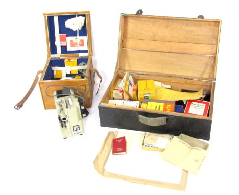 A stained pine chest and contents, of various camera equipment, major developing tank, lights, negatives, photographs, etc. T