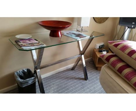 Glass console table with crossed metal legs 120 cm wide, 45 cm deep, 74 cm high, from Garden Room 1.  
