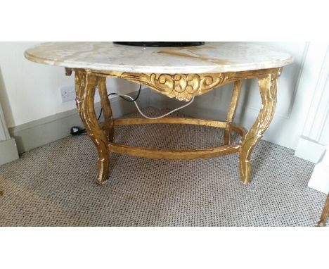 Coffee table with marble oval top, gilt wood legs (scuffs and marks and gilt loss) 108 cm long, 58 cm high, 64 cm deep