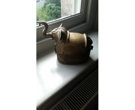 Two brass ornaments, one in form of elaborately decorated elephant 16cm high to top of trunk, 23 cm wide, plus a brass vintag