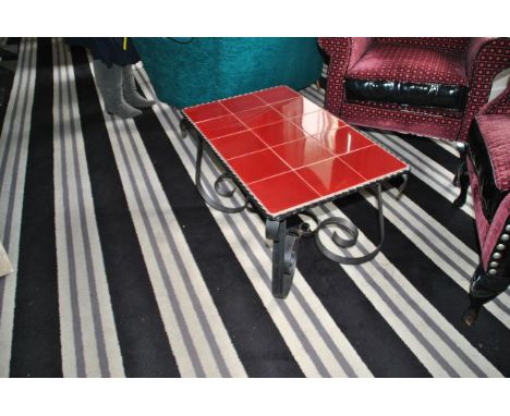 Red tiled coffee table with scrolled iron legs 78 cm wide, 48 cm deep, 44 cm high, from the Restaurant Ante room