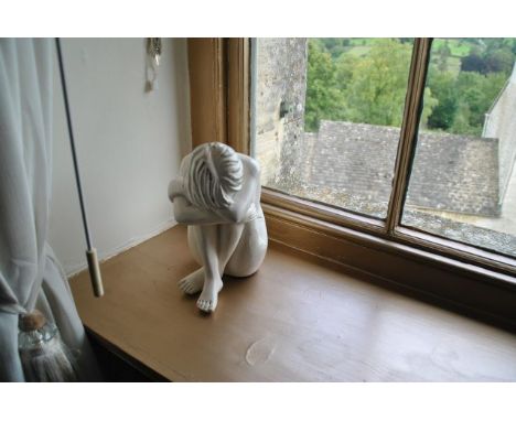 Ceramic sculpture of a sitting girl, from Room 15