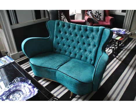 Turquoise sofa with black piping detail 130 cm wide, 83 cm high at back, 70 cm deep,  from the Restaurant Ante-room