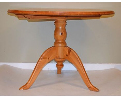Modern natural pine circular topped dining table on a pillar and tripod base   Condition: 