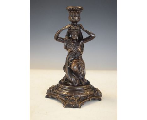 Bronzed metal figural candlestick  decorated with a classical maiden   Condition: 