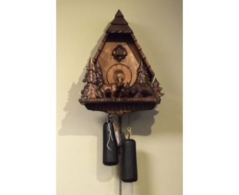 Black Forest carved cuckoo clock decorated with bears amongst fir trees   Condition: 