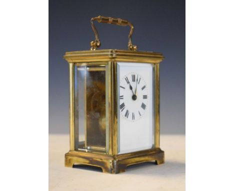 French brass cased carriage clock, the white enamel dial with Roman numerals, together with an outer carrying case   Conditio