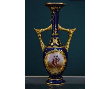 Zsolnay baluster shaped two handled vase having transfer printed decoration depicting a romantic couple on a heavily gilded b