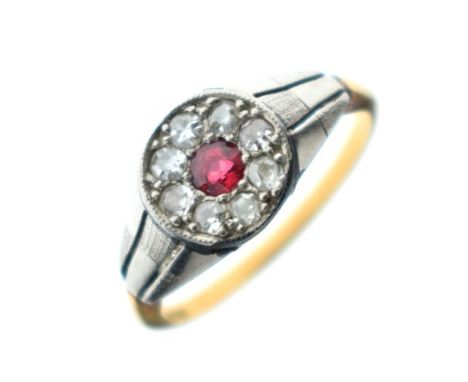 Ruby and diamond cluster ring, the shank stamped 18ct, size M½   Condition: 