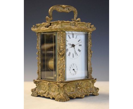 Large cast brass cased repeat carriage clock, the white enamel dial with Roman numerals and subsidiary alarm dial   Condition
