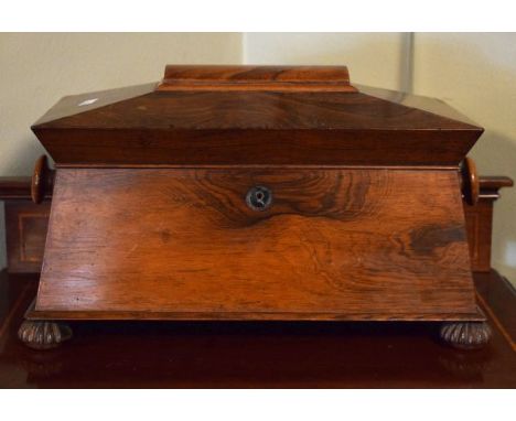 Victorian rosewood sarcophagus shaped tea caddy, the hinged cover opening to reveal a fitted interior with two containers and