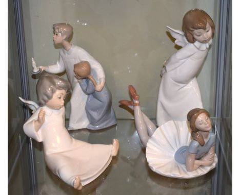 Collection of four Lladro figures, two depicting young angels, another depicting two children at bedtime and the fourth depic