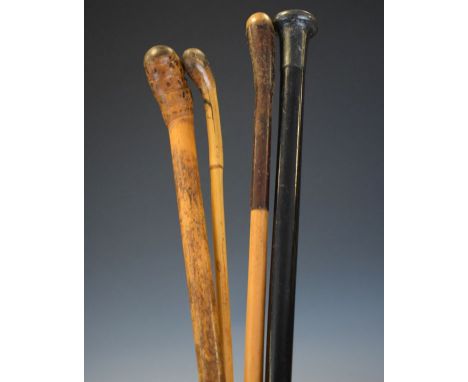 Silver mounted walking stick and three others   Condition: 