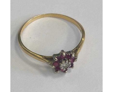 RED AND WHITE GEM SET FLOWER CLUSTER RING, the central round white gem surrounded by round red gems in flower cluster formati