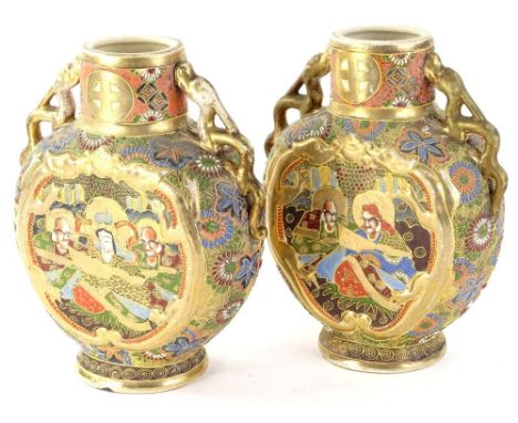 A pair of Japanese Satsuma moon flask vases, each decorated with figures within elaborate scroll and floral pattern on circul