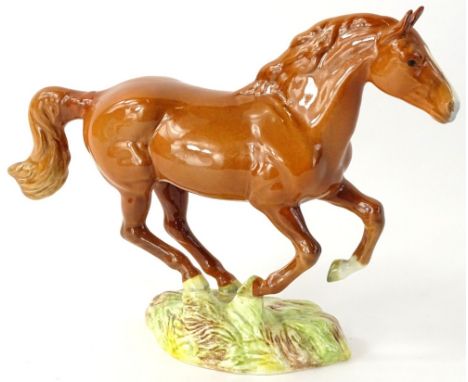 A Beswick Chestnut gloss model of a galloping horse, numbered 1374 to underside (AF).