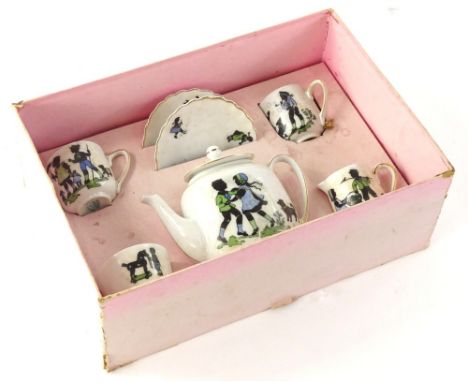 A Victorian Czechoslovakia child's tea service, decorated with figures, children in silhouette in original box.