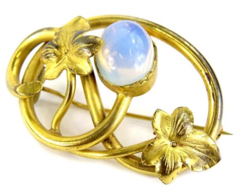 A Victorian gilt metal brooch, with spray design of leaves, with central imitation opal, in rub over surround, with single pi