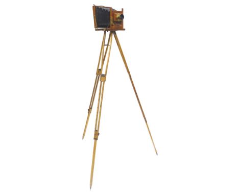 A Thornton Pickard Victo camera, with mahogany and brass casing, containing lens stamped Time and Inst. Patent, etc., and a c