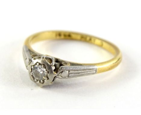 An 18ct gold and platinum dress ring, in the Art Deco style with central illusion set diamond, ring size K½, 2.2g all in. 