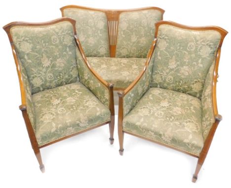 An Edwardian mahogany and marquetry three piece suite, comprising two seat sofa with padded back sides and seat, the shaped s