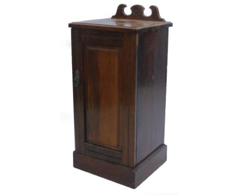 A late 19thC walnut pot cupboard, with a raised back above a panel door on plinth base, 35cm W.