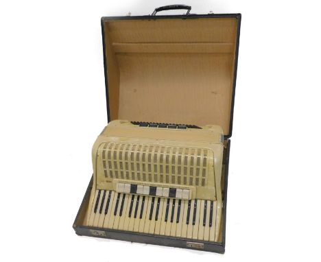 An opalescent plastic or Bakelite piano accordion, possibly Italian, 49cm W.