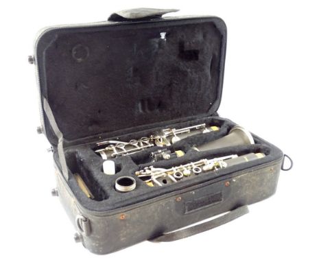A cased Sonata ebonised clarinet, with chrome plated mounts in fitted case, 35cm W.