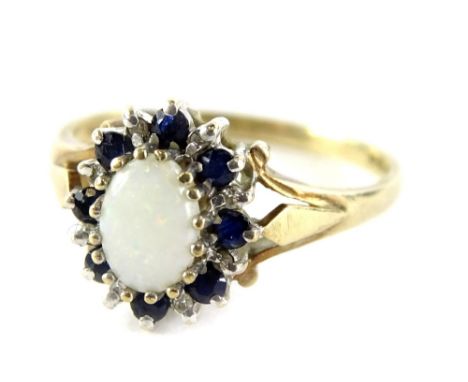 A 9ct gold cluster ring, with central opal surrounded by blue and white stones, each in claw setting, ring size O½, 2.6g all 