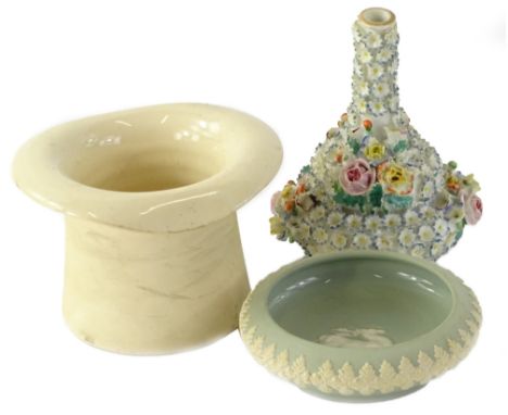 A late 19thC English porcelain flower encrusted bottle shaped vase, 10cm H, a top hat shaped vase and a Dudson Jasperware dis