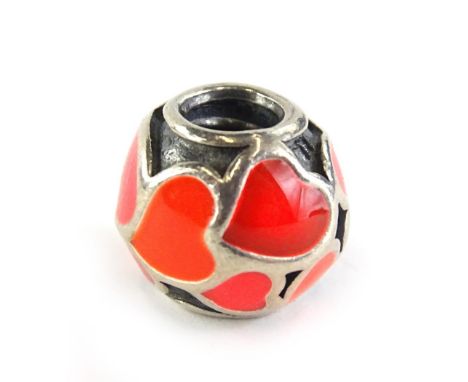 A Pandora charm, with red enamel heart design, marked 925 ALE, 4.4g all in. 
