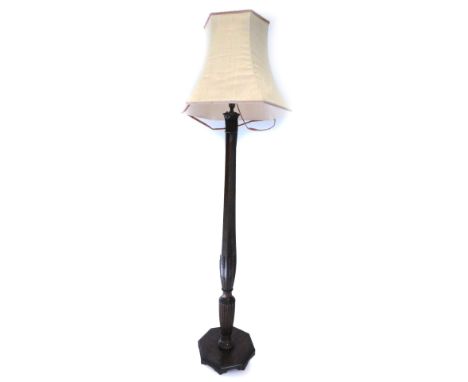 A mahogany standard lamp, the boxwood and ebony strung octagonal column carved with wheat ears and flutes on an octagonal pla