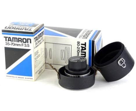 Various camera lenses, to include a Tamron boxed 35-70mm f/3.5 macro compact zoom lens, a Tamron 18-210mm f/3.8-4 lens and  a
