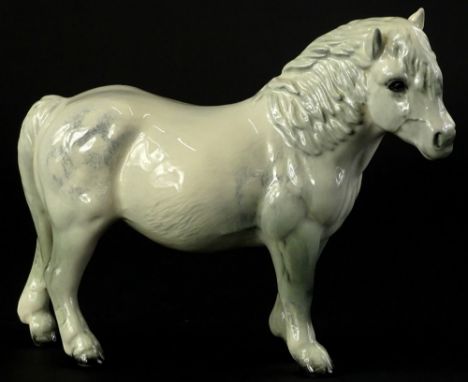 A Beswick model of a grey pony, 18cm L.