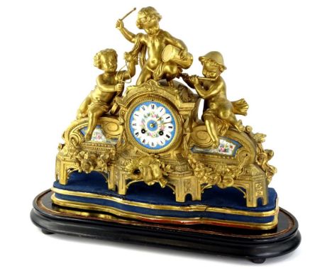 A French gilt metal figural mantel clock, with Sevres style porcelain mounts, painted with flowers, the dial decorated with R
