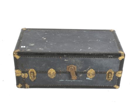 An early 20th century travel steamer trunk. By The South China Goods MFG. Co. With brass fittings and riveted reinforced edge