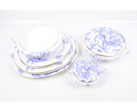 Eight pieces of Royal Worcester tableware. Comprising oval chargers, two tureens and a pot. Decorated with a blue and white t