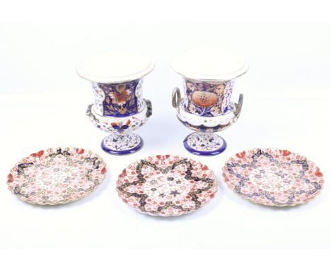 A pair of 19th century campana urns and three Spode Copeland plates - Imari style. Urns H20.5cm, plates diameter 20.5cm 