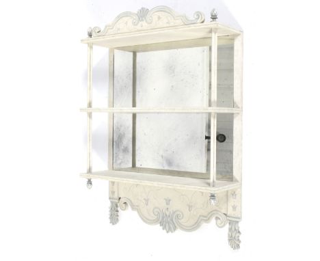 A hanging shelf with a mirror back. Painted white with blue decoration. L61cm x D18.5cm x H83cm