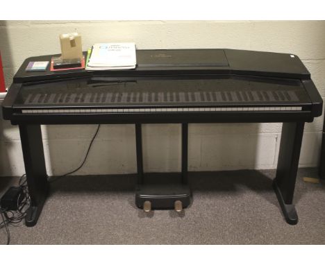 A Yamaha Clavinova CVP-50 digital piano. Comes with stand, foot pedals, Owner's Guide book and other music books, etc. All ke