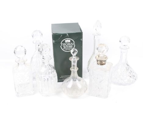 Ten glass decanters. Including a boxed Thomas Webb crystal example and one with a silver collar, the marks for Charles S Gree