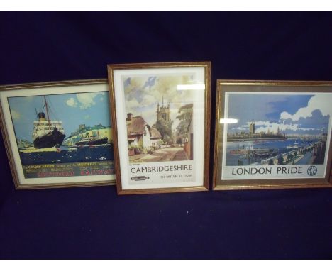 Two framed and mounted reproduction railway advertising posters including 'London Pride GWR' and the 'Golden Arrow Southern R