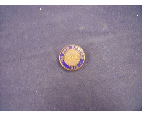 Brass and enamel On War Service 1915 L.G.O.C no. 321 by Toye & Co. London 