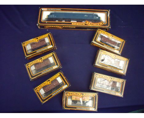 Boxed mainline OO gauged diesel engine for Manchester Regiments and 7 boxed mainline goods, vehicles, rolling stock etc. (8) 