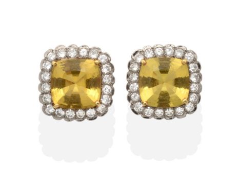 A Pair of 18 Carat Gold Yellow Beryl and Diamond Cluster Clip Earrings, a cushion cut yellow beryl within a border of round b