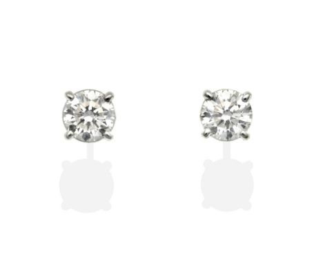 A Pair of 18 Carat Gold Solitaire Diamond Earrings, round brilliant cut diamonds in claw settings, total estimated diamond we