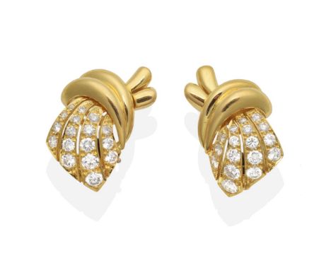 A Pair of 18 Carat Gold Diamond Clip Earrings, scroll motifs set with graduated bands of round brilliant cut diamonds, total 