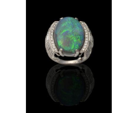 An Art Deco Style Black Opal and Diamond Ring, an oval cabochon black opal in a claw setting to round brilliant cut and bague