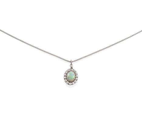 An Opal and Diamond Cluster Pendant, on Chain, an oval cabochon opal in a claw setting, within a border of old cut diamonds, 