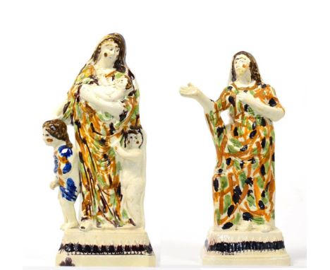 A Pair of Prattware Figures of Faith and Charity, possibly Herculaneum, circa 1800, each wearing ochre, green and brown decor